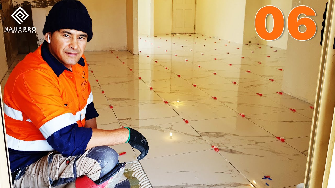 Remove Existing Main Floor Vinyl Tile and Install New 600x600 (mm) tile 06