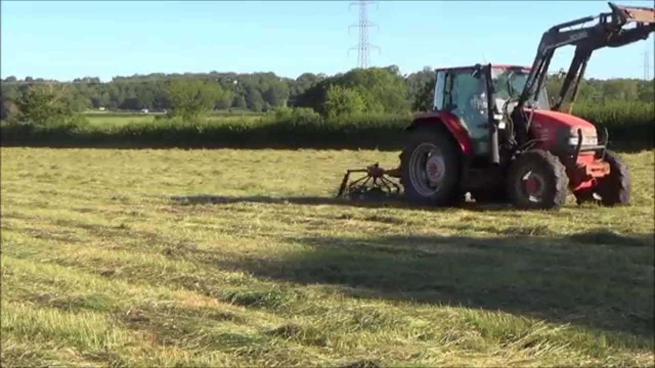 Tedding grass for hay 2015