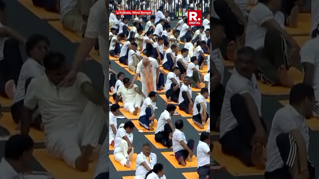 Participant Touches PM Modi's Feet at Yoga Day Event in Kolkata