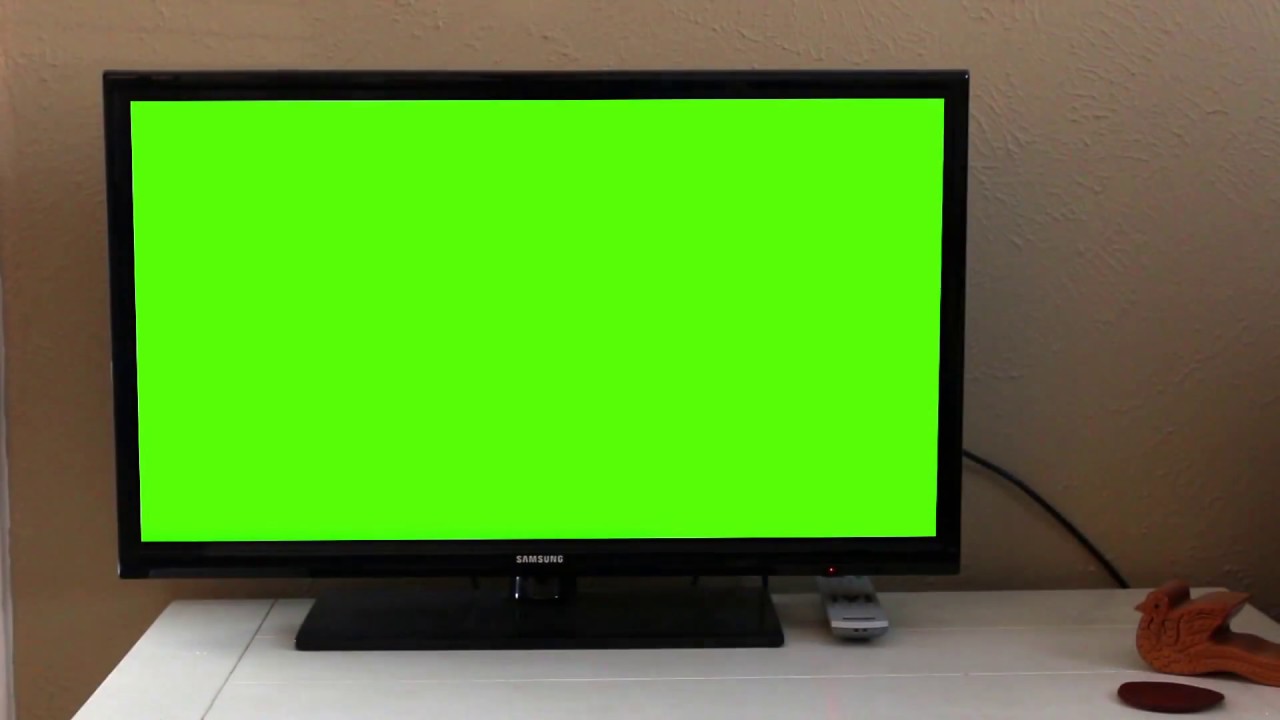 Hand with Remote Turns on Green Screen TV (Royalty Free Use)