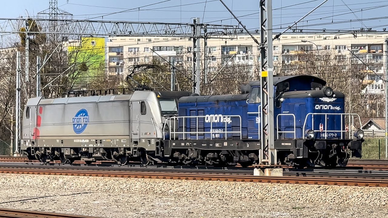 Stacja kolejowa Gdańsk Wrzeszcz ORION Kolej siłacze na torach lokomotywa Traxx E594 015 & SM42-2208