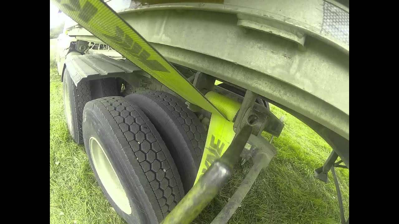 Strapping down a load of hay