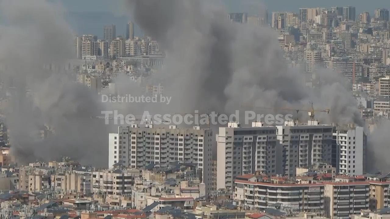 Explosion and plumes of smoke rising in Beirut following Israeli strike