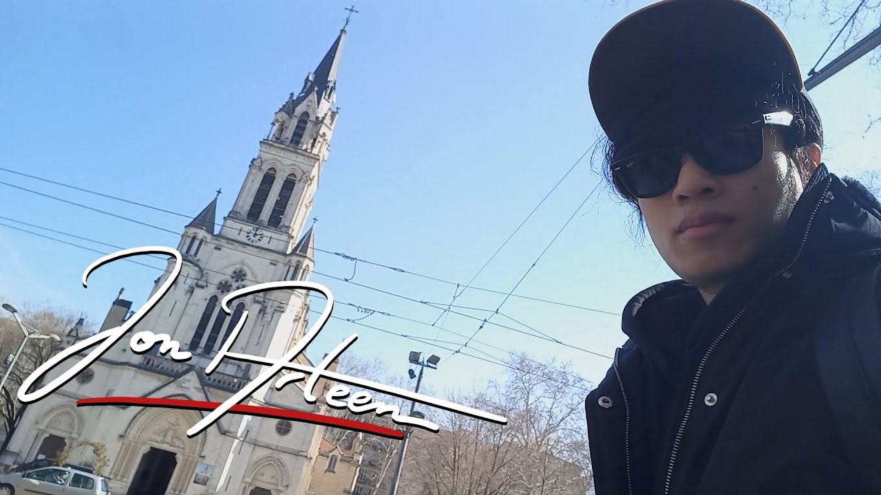 Jon Arteen walks in front of a church that looks like a Disney castle
