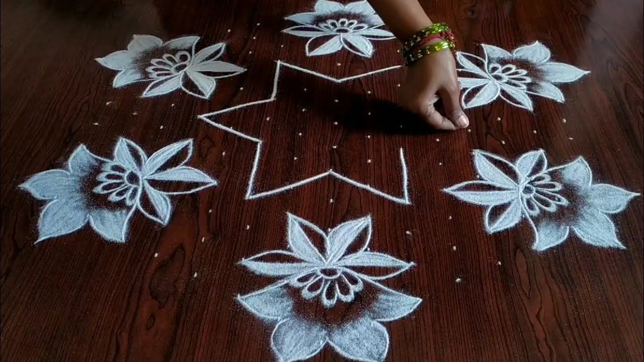 Sankarthi chukkala muggulu (15×8) Dot's.. latest flower design rangoli