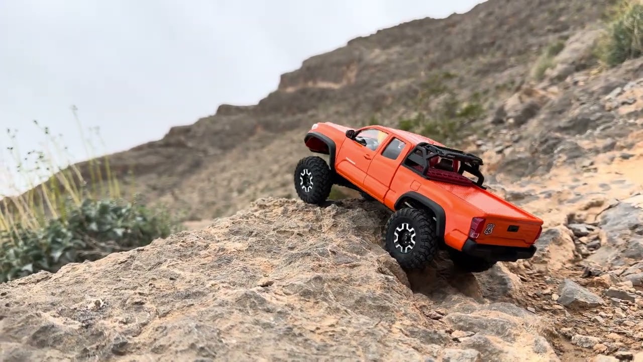 Fcx24m Tacoma over rock terrain #fcx24 #rccrawl #tacoma 