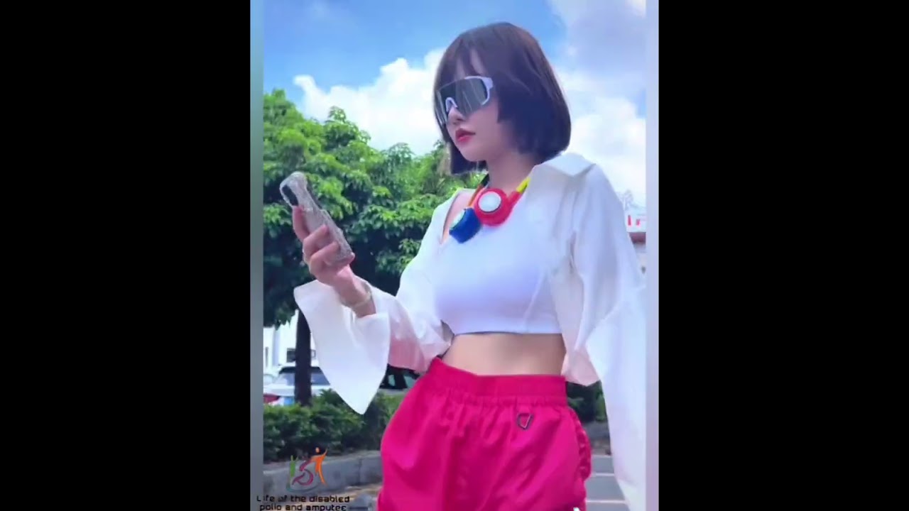 The beautiful woman has an amputated leg and arm and walks on an artificial leg #amputee