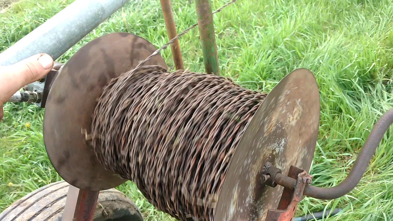 Rolling up old fence Ag Wild