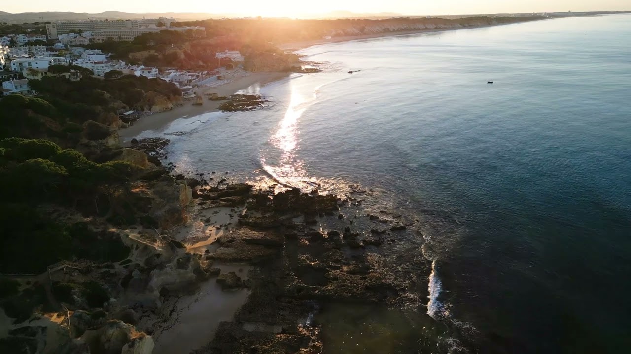 Algarve, Coastal Path from Maria Luisa to Olhos d'Agua from above. DJI mini 3 pro. Sunrise time.