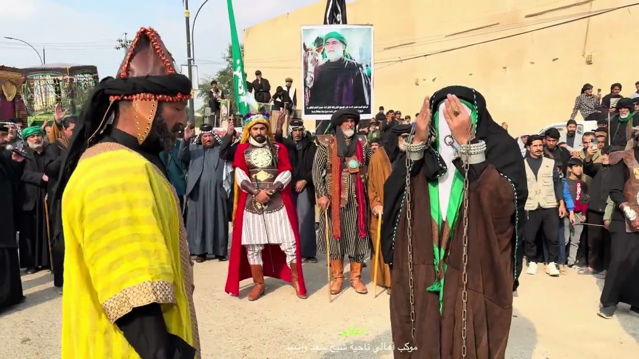 وقفة موكب اهالي ناحية شيخ سعد امام الدار الذي توفى بها السيد محسن علي الموسوي في مسيرة الامام الكاظم