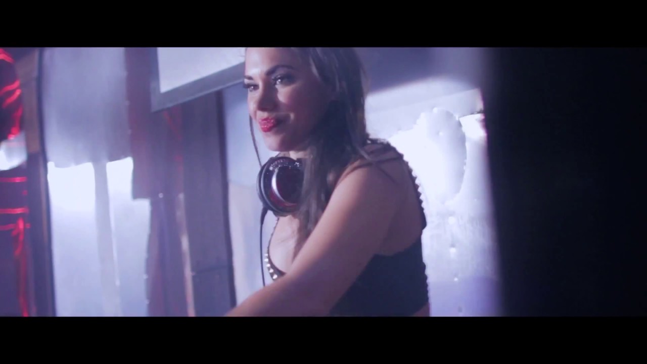 DJ Rhiannon spins on turntables (Sevilla Nightclub, Long Beach, California)