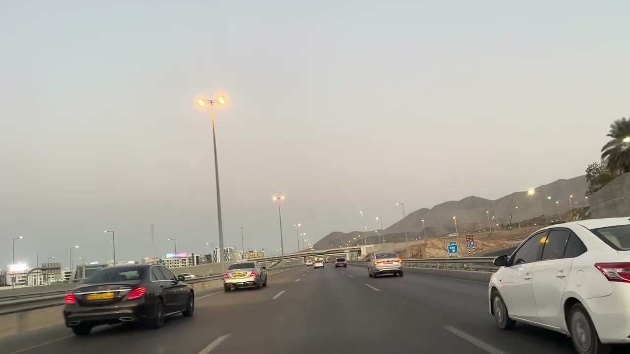Gliding through the city at dusk, where lights awaken and every street feels like a movie scene