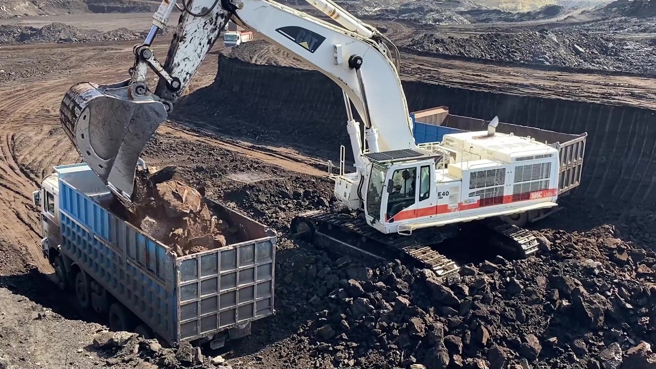 Coal Mine Opening: Caterpillar 385C Excavator Loading Coal at 60 Meters Depth - Interkat SA