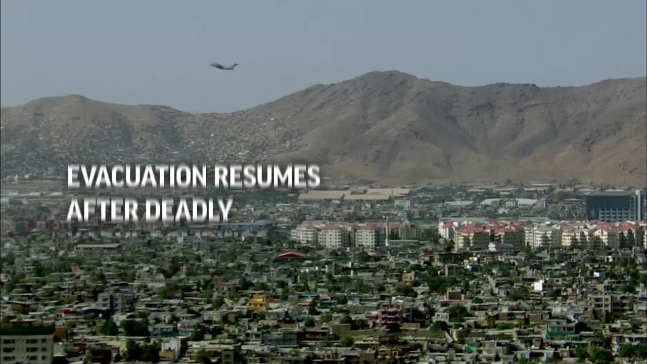 People wait for flights in Kabul, day after blasts