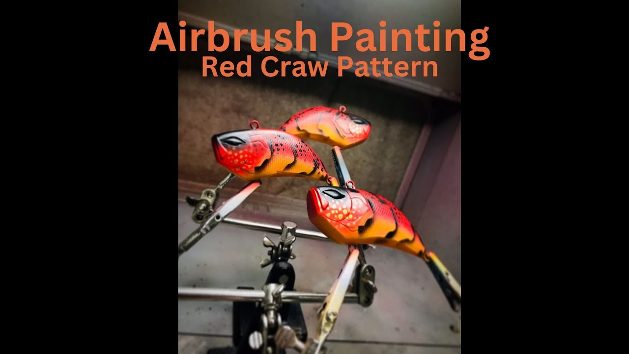 Custom airbrush painting a Red Craw pattern on lipless crankbaits