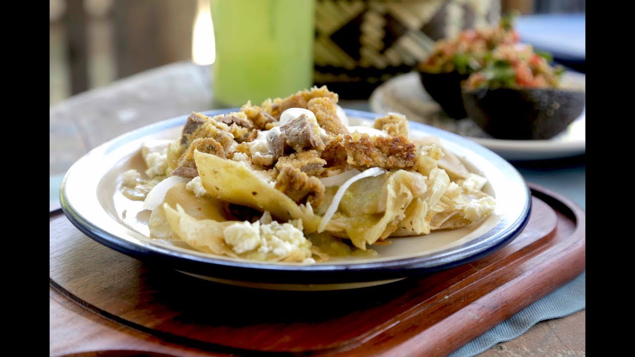 Chilaquiles with green sauce and breaded beef steak- Mexican breakfast recipes