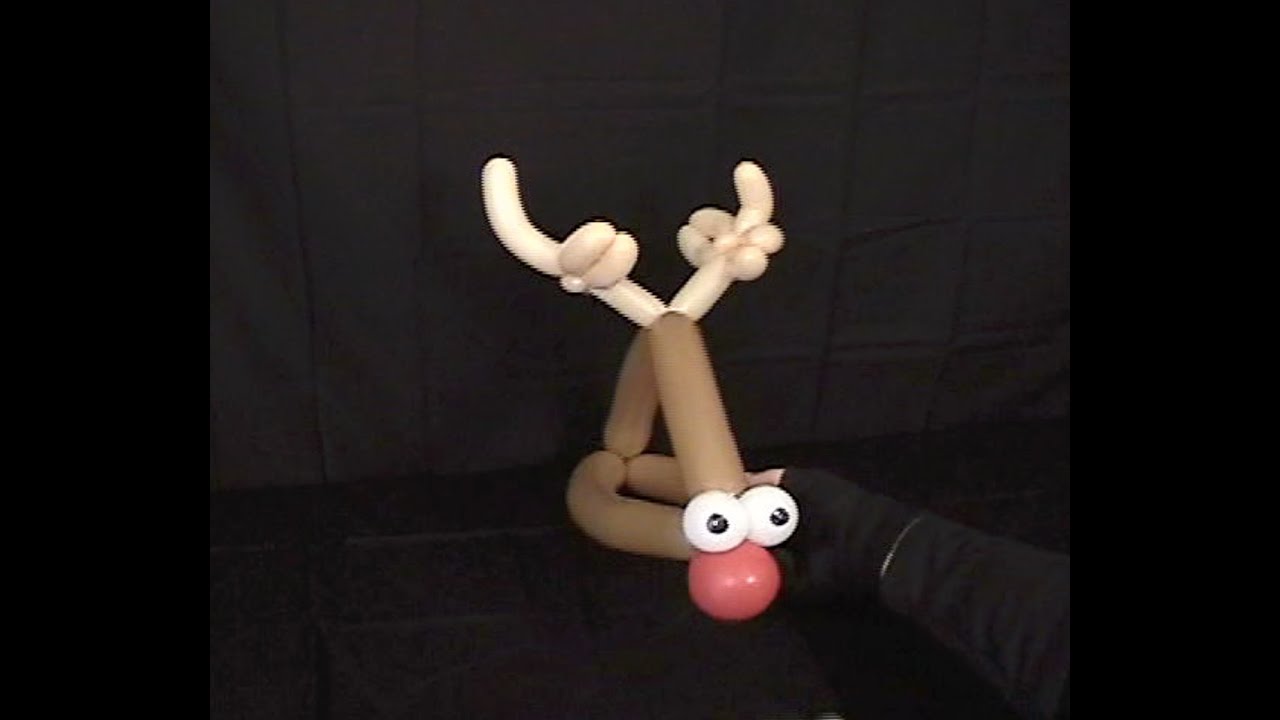 Learn how to make a silly balloon animal reindeer hat using balloon twisting