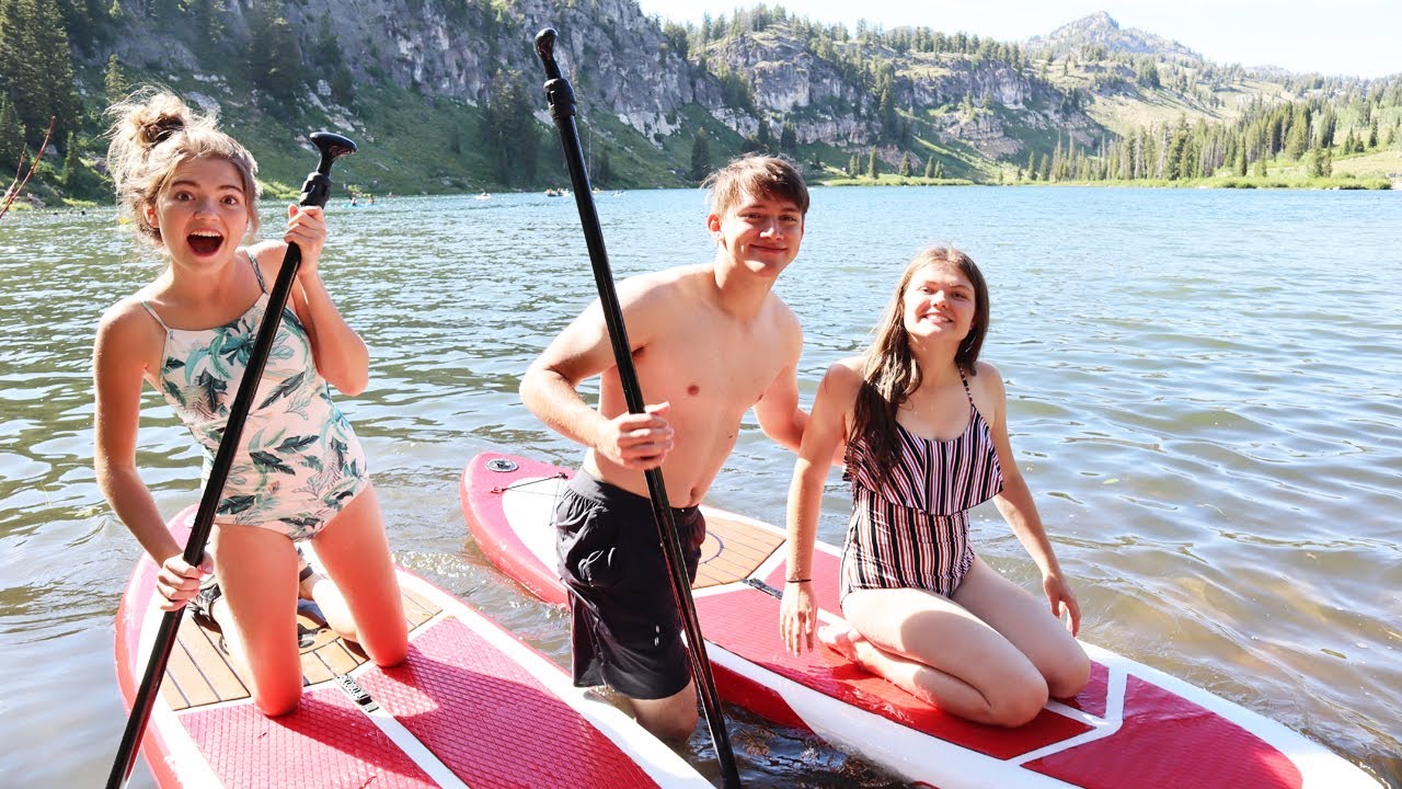 Taking A Break From Wedding Planning To Go Paddle Boarding At The Lake
