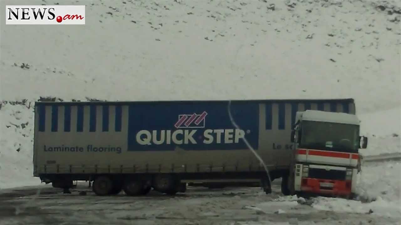 Trucks stuck on highway because of snow
