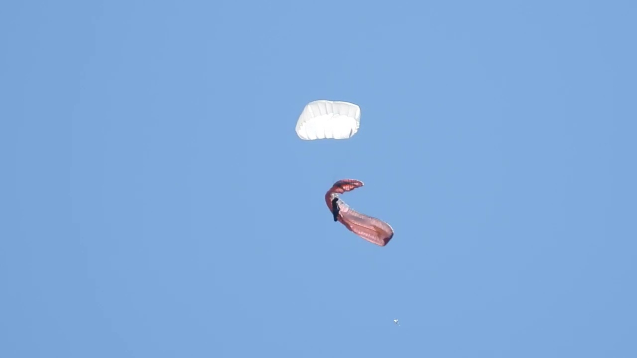 Heavy used paraglider with current check breaks during autorotation.