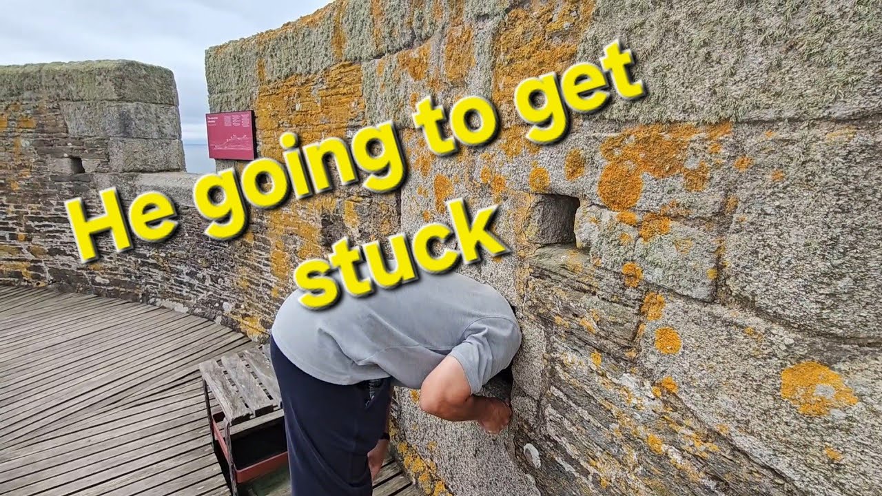 Sticking his head in holes @ st mawes castle 