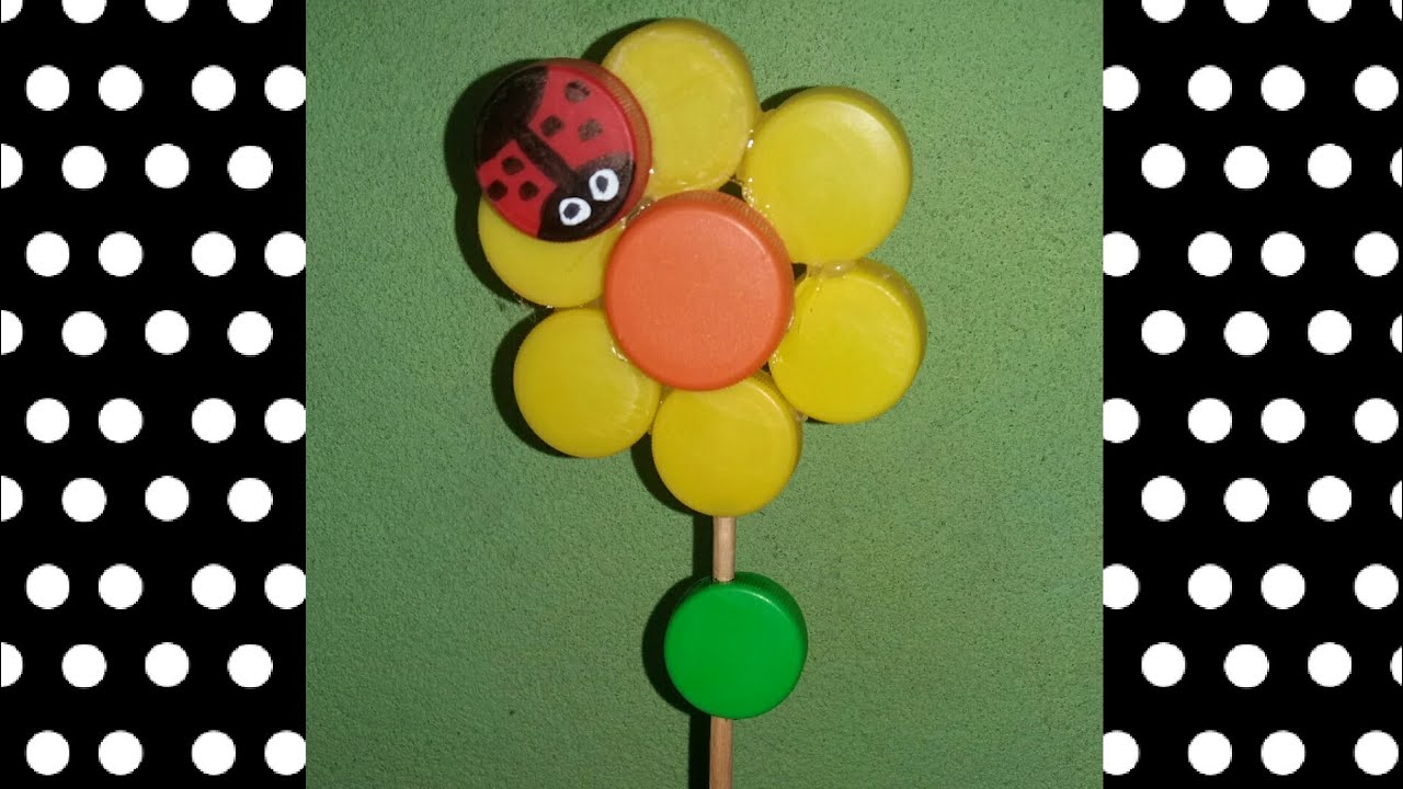 Flor en material reciclable....tapas de gaseosa