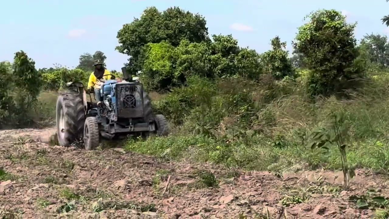 Farmer Plowing the Farm Land for Crop Cultivation