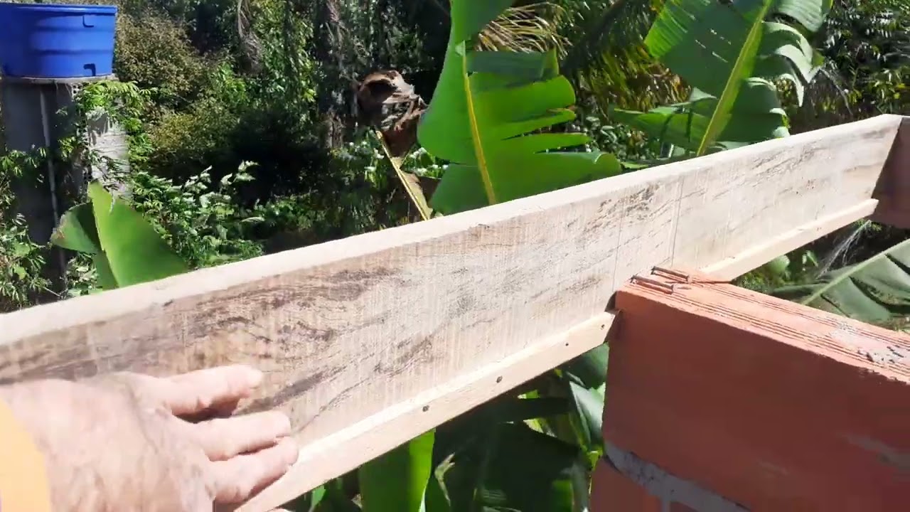 mostrando como se fais uma Lage em cima de uma cruzeta de  caixa da água