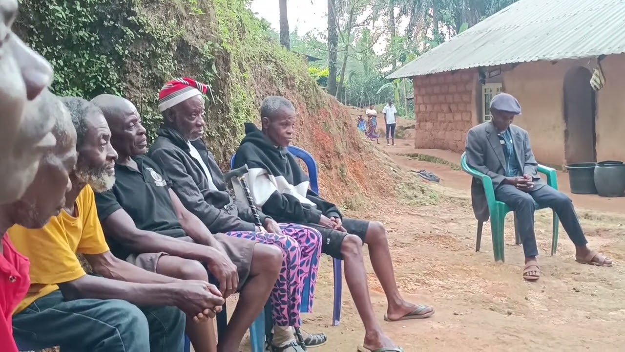 Richards shares the Gospel of God's redeeming love with the Gate-keepers of Imale Kotele.