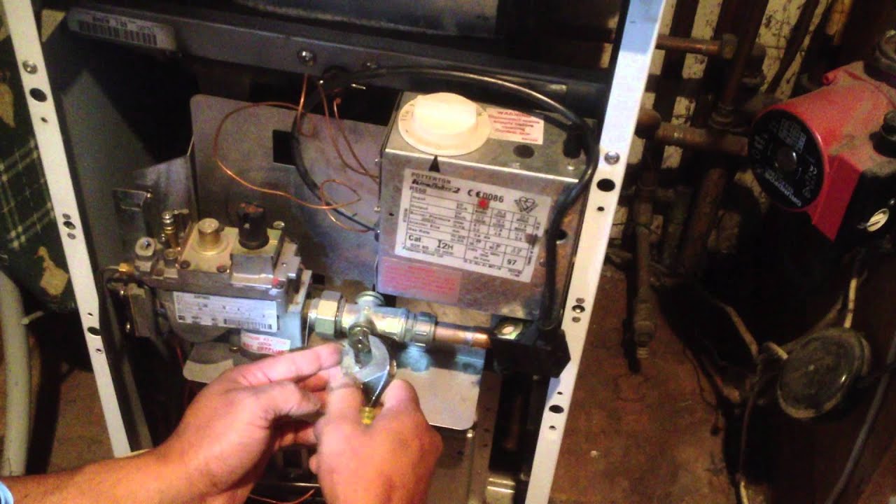Removing the burner of a Kingfisher Boiler- emmegency plumber london NW N W S E SE SW EC WC