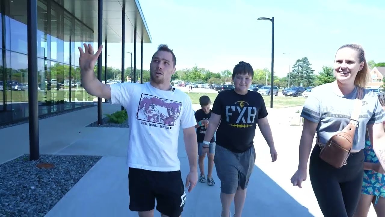 Olympian Spencer Lee tours Iowa wrestling facility with Children's Hospital patient