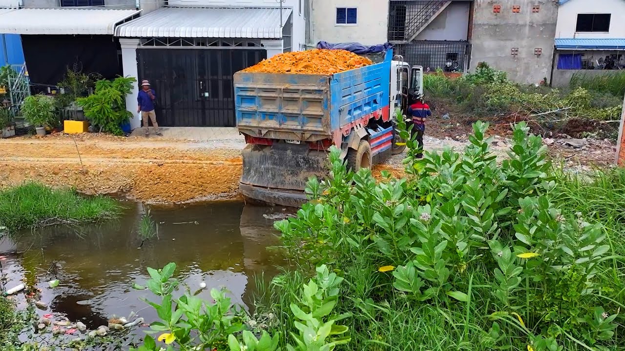 Incredible  landfill build house project . ! Truck transport soil with Bulldozer push soil to water