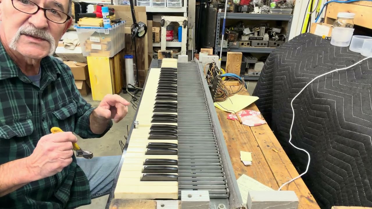 Adjusting key manuals to the proper tension. 