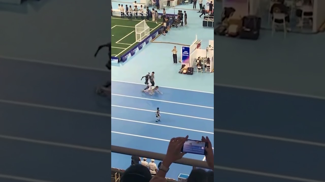 Running robot knocks person over on athletics track in Beijing
