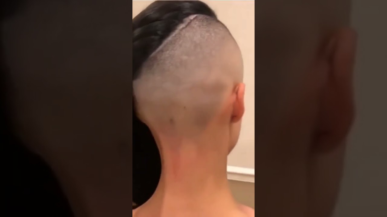 Girl long undercut shaved sides