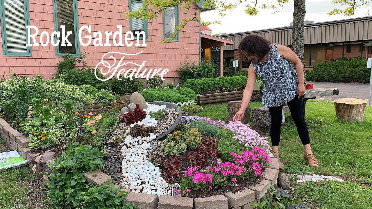 A beautiful small garden with a stunning rock garden feature | Early June, NB Canada