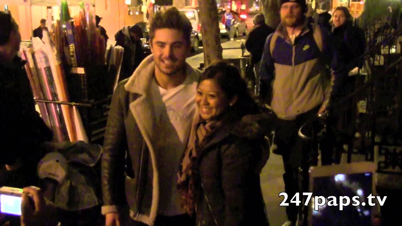 Zac Efron came outside and took pictures plus autographs for his fans in NYC