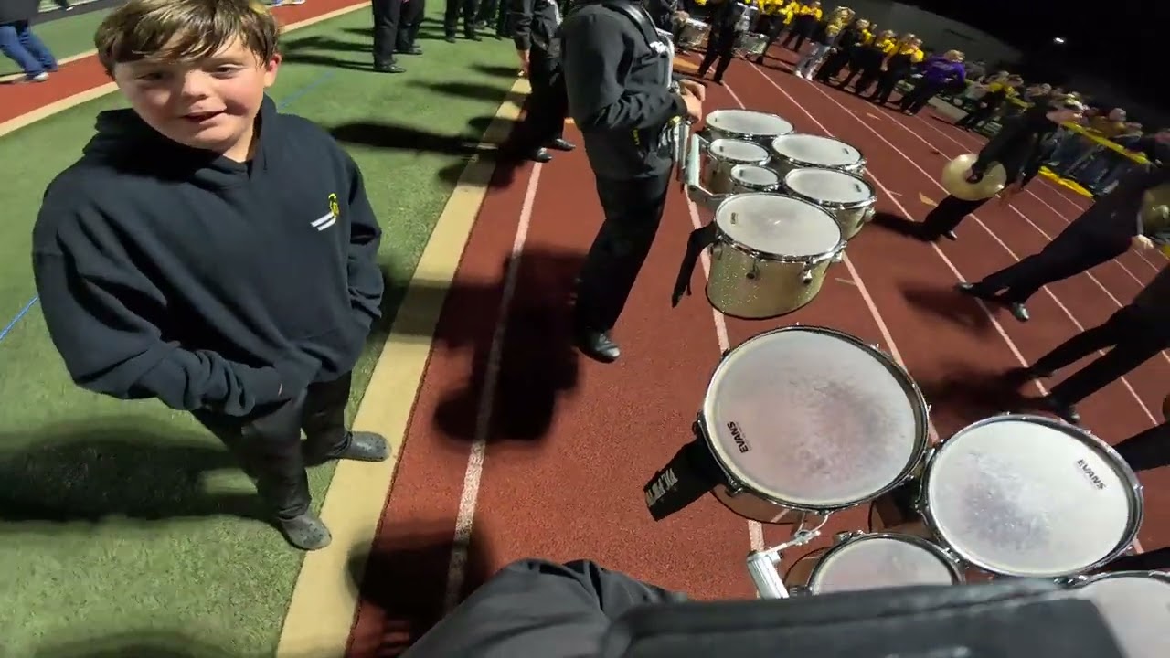 Senior tenor drum player during drum party during third quarter in football.