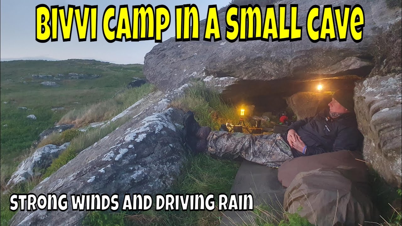 bivvi camp in a small cave hit by strong wind and driving rain