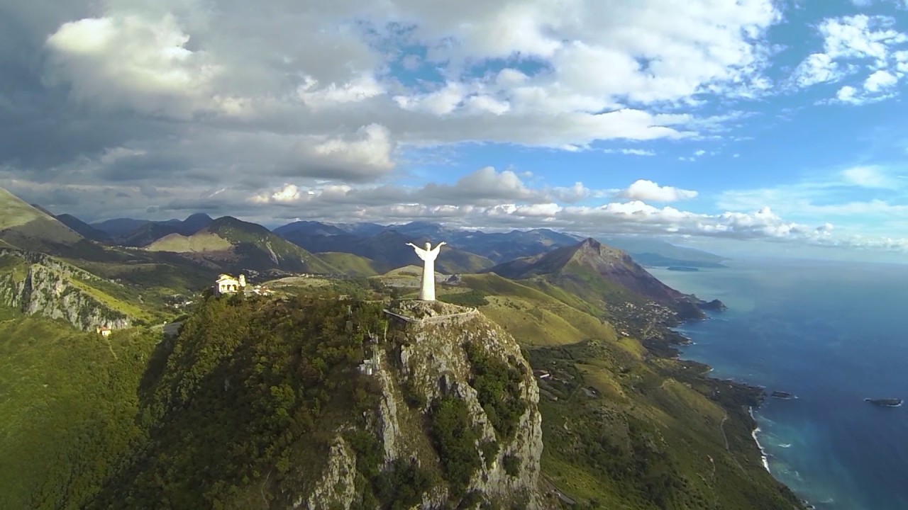Paragliding close to Chrystus monument at Maratea, Italy