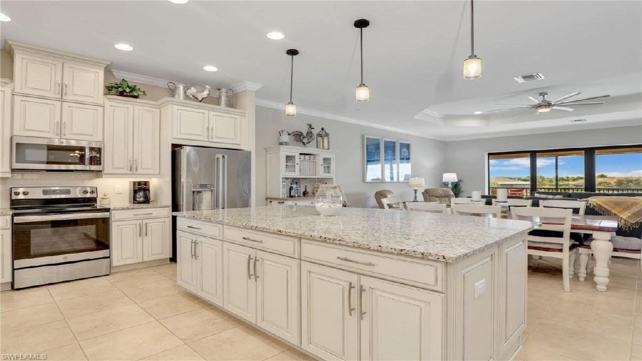 Luxury Coach Home in Esplanade Naples | 3+Den | Lake Views & Resort Amenities