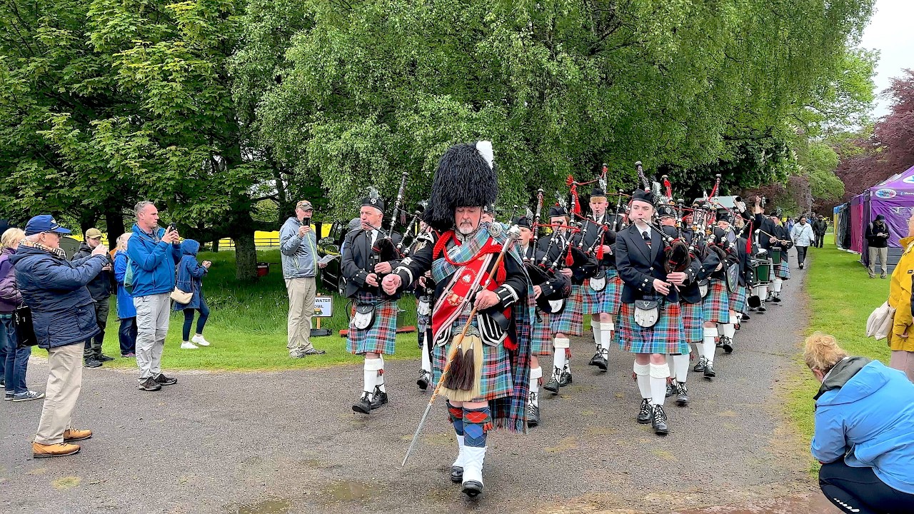 Strathisla Pipe Band march in playing Bonnie Dundee at Gordon Castle Highland Games in Scotland