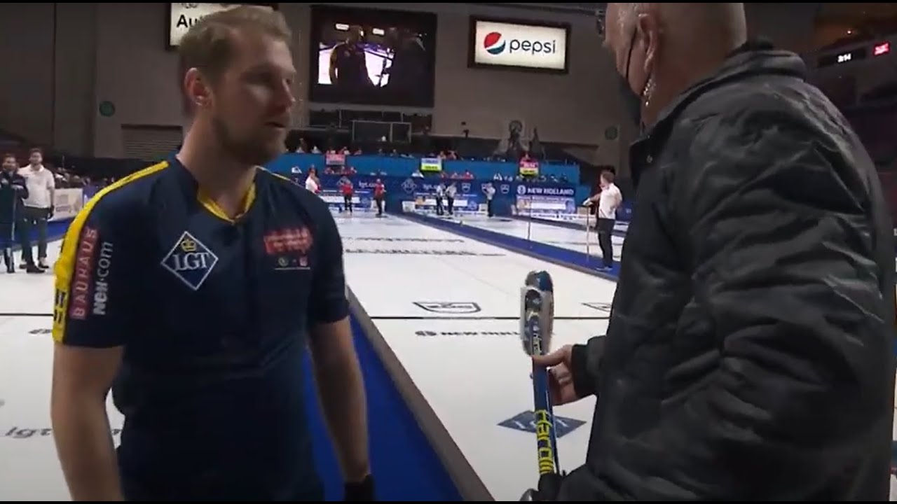 #wmcc2022 Emergency broom swap! Rasmus Wran&aring; puts his head on Christoffer Sundgren's shaft!