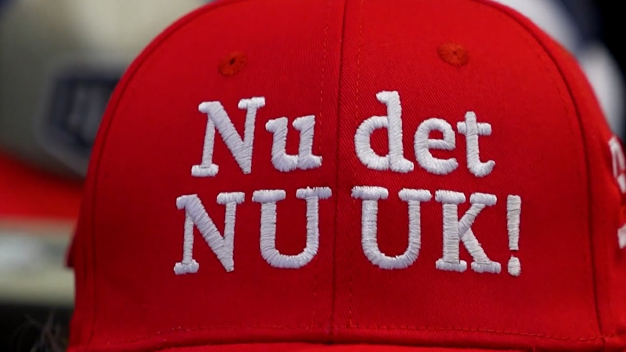 Protestors In Denmark Wear Red Ball Caps With Messages Supporting Greenland