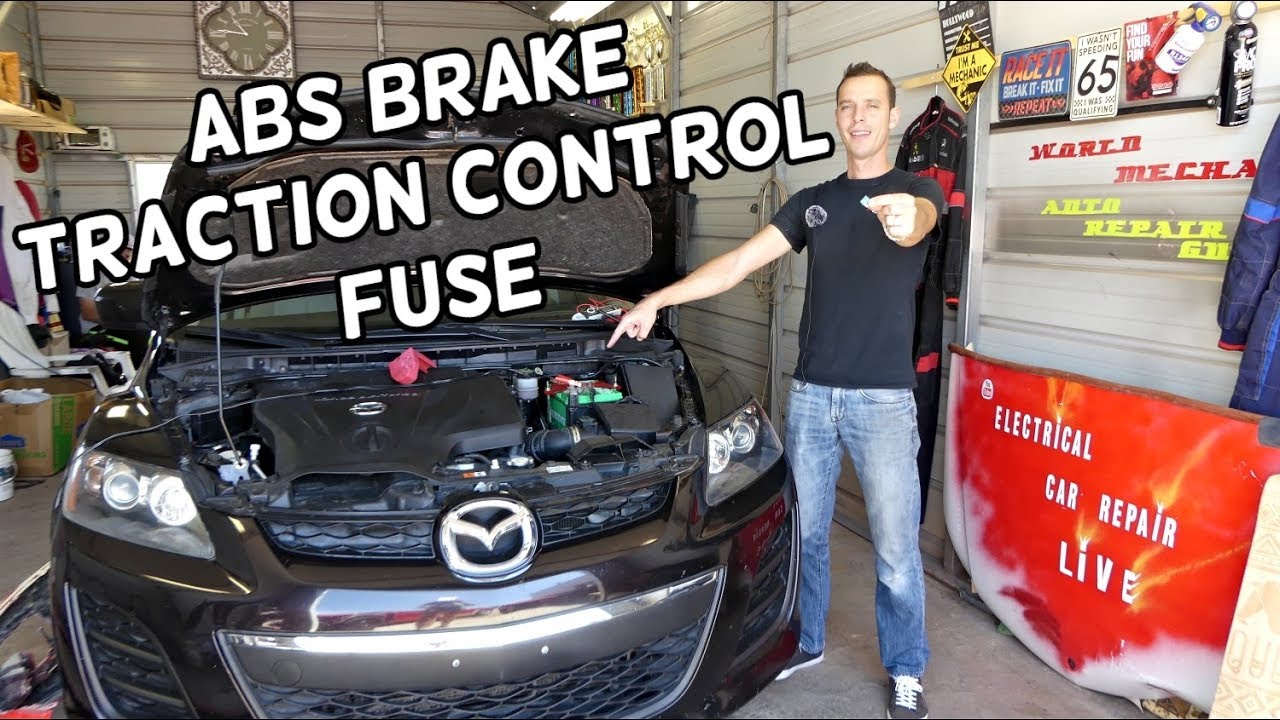 Замена предохранителя системы контроля тяги, ABS, тормозов MAZDA CX-7