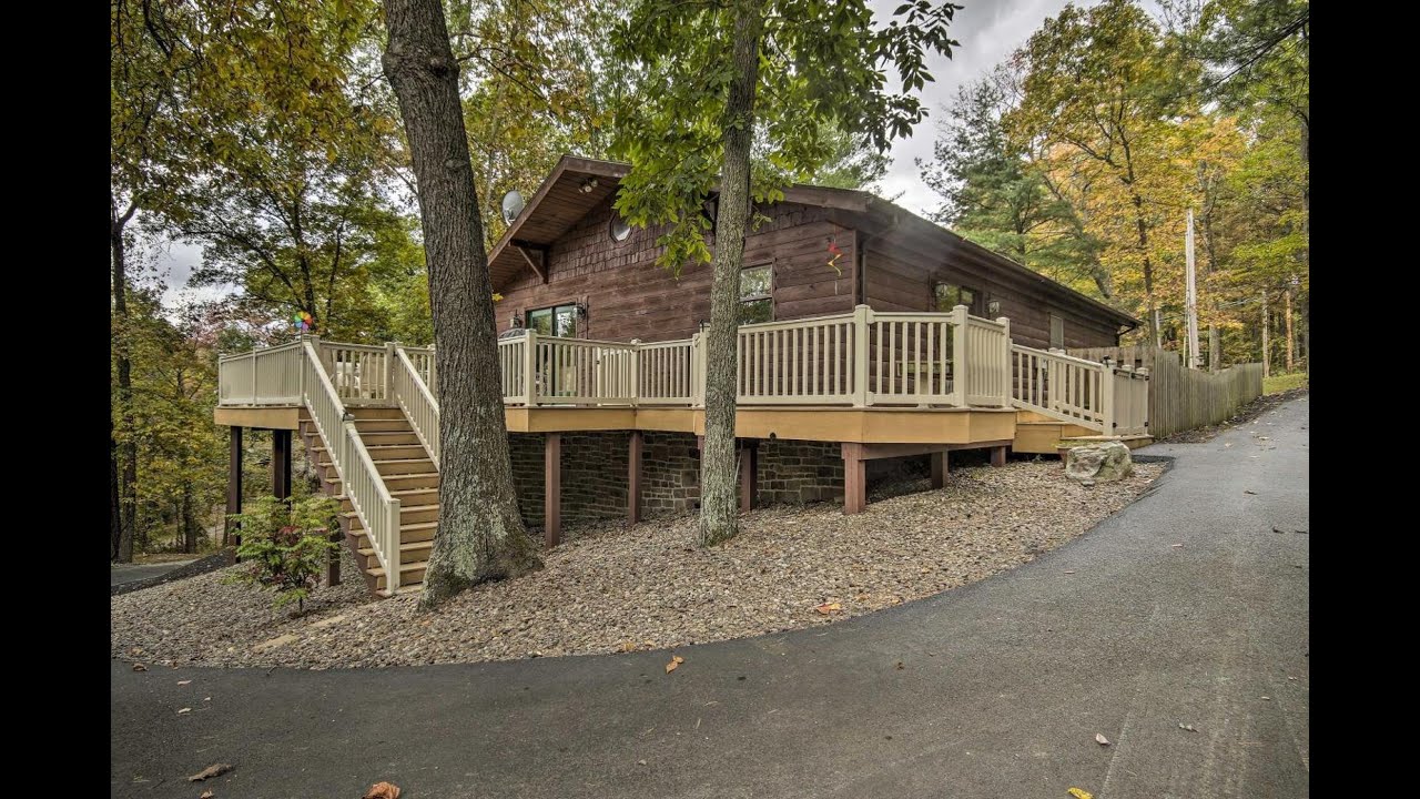 Deck with Private Hot Tub Lakefront Raystown Cabin! | Cabins in Hesston