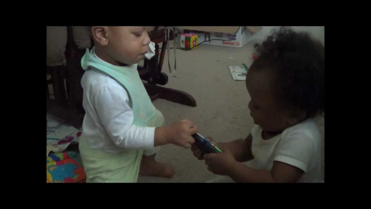 Twins Fighting Over A Remote