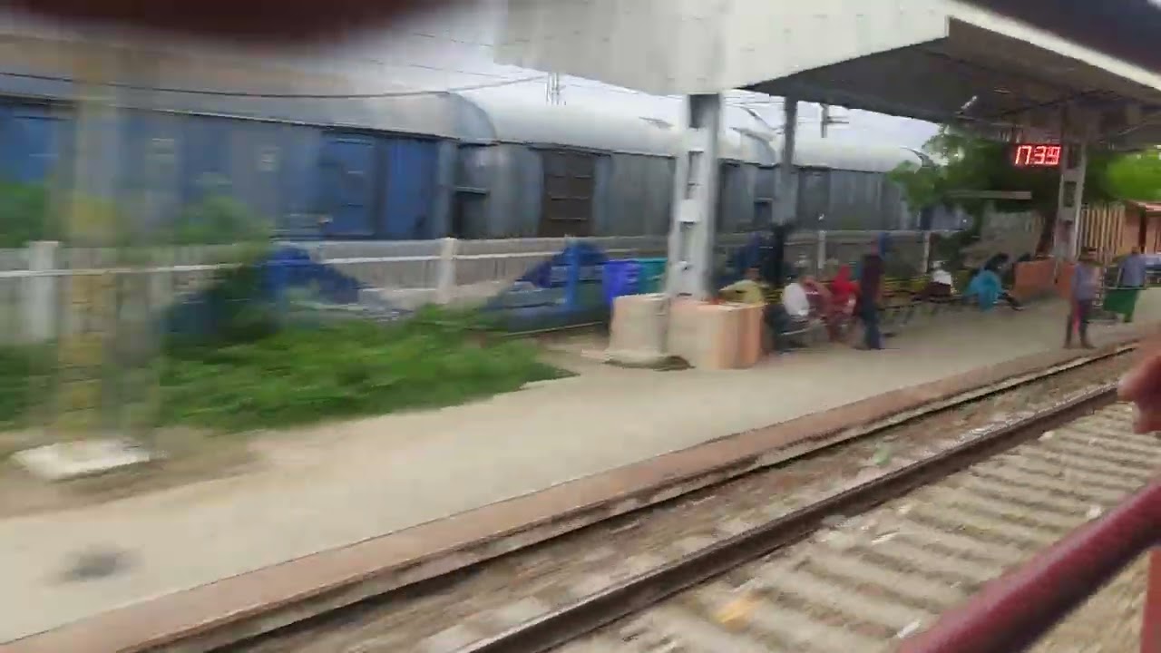 High Speed train crossing platform and a long goods train