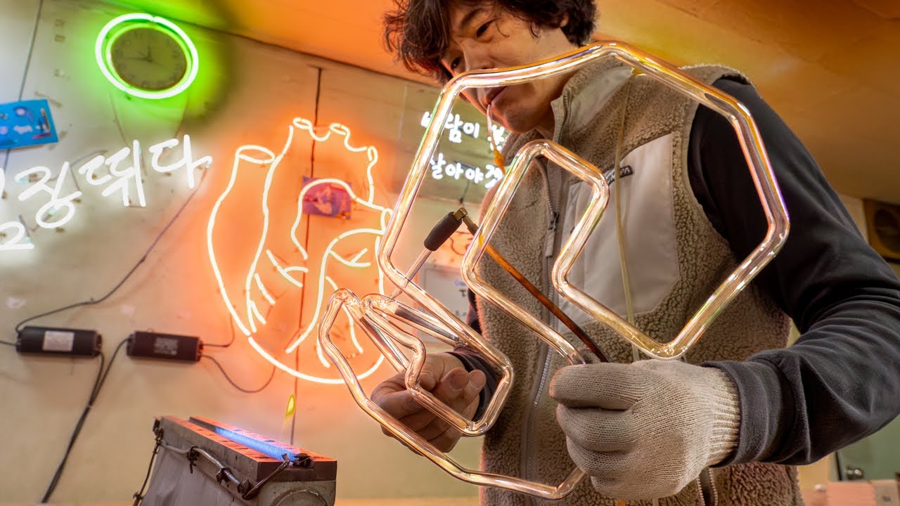 A Man Bends Glass Tubes into Eye Catching NEON SIGN for Bar. Neon Light Master in Korea