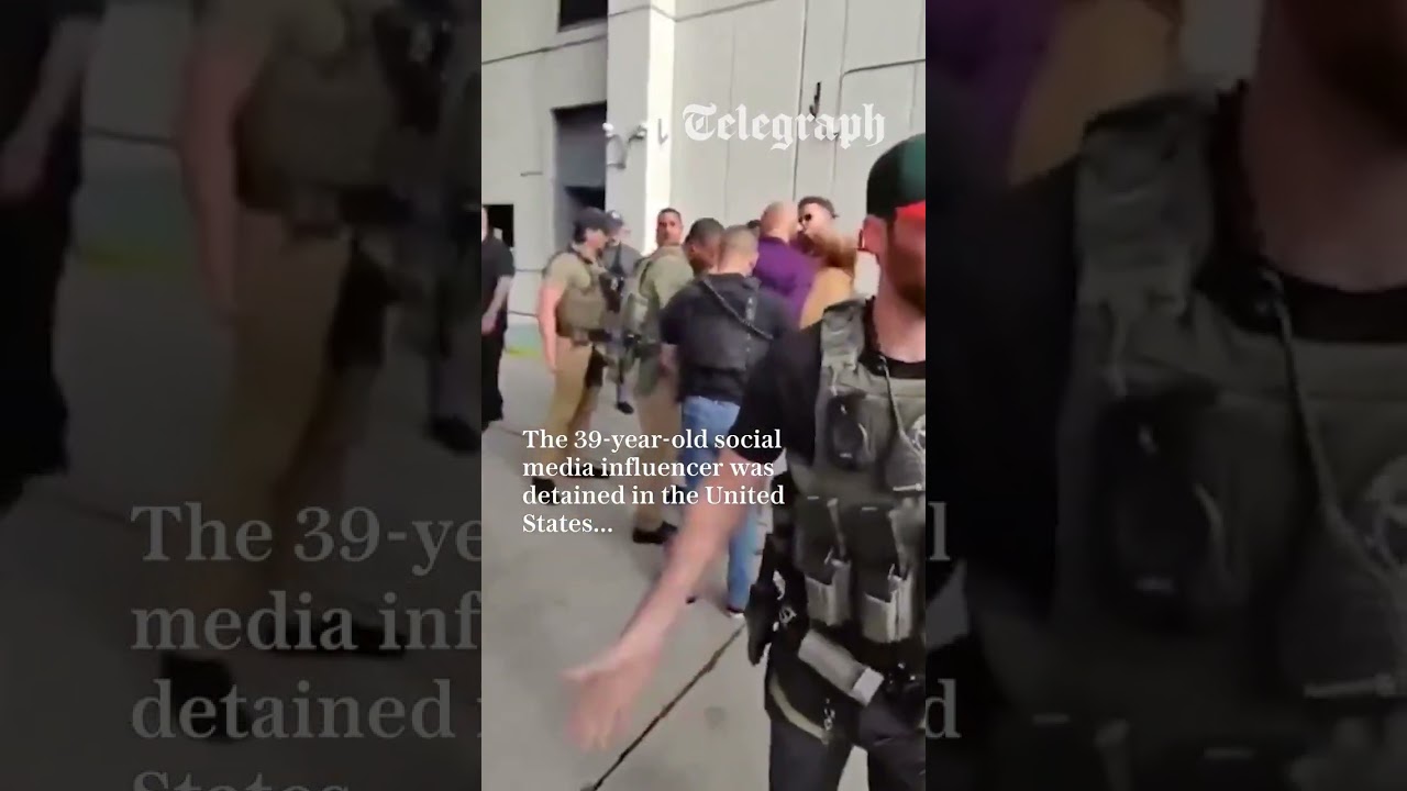 Andrew Tate gives phone away during arrest